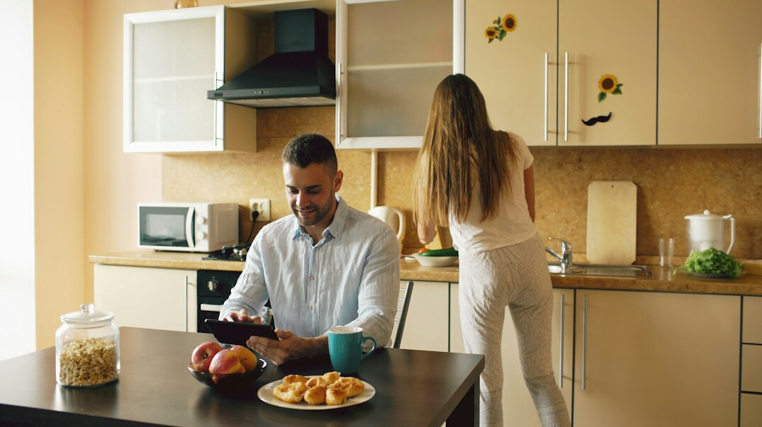person reviewing budget at kitchen table