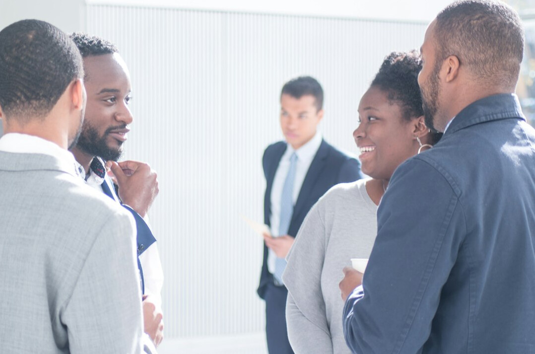 diverse people discussing investments