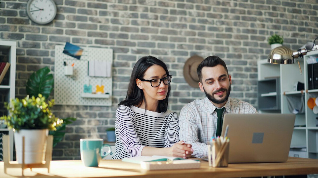 couple creating budget spreadsheet