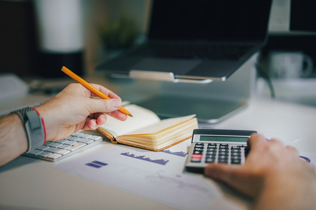 person managing budget at desk