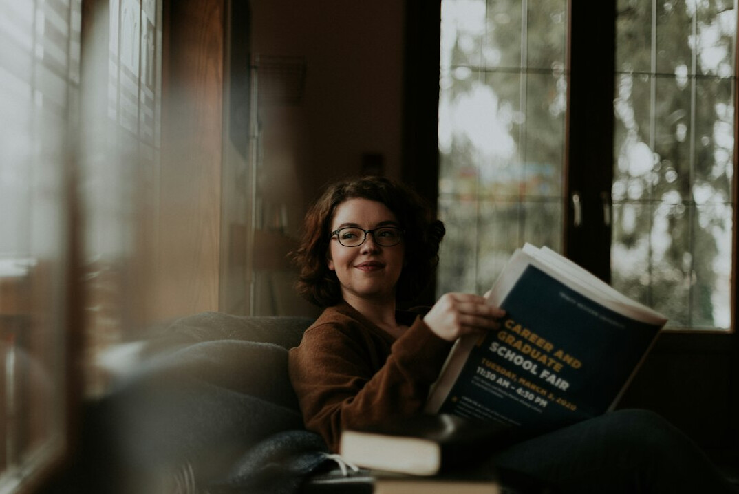 person reading financial book